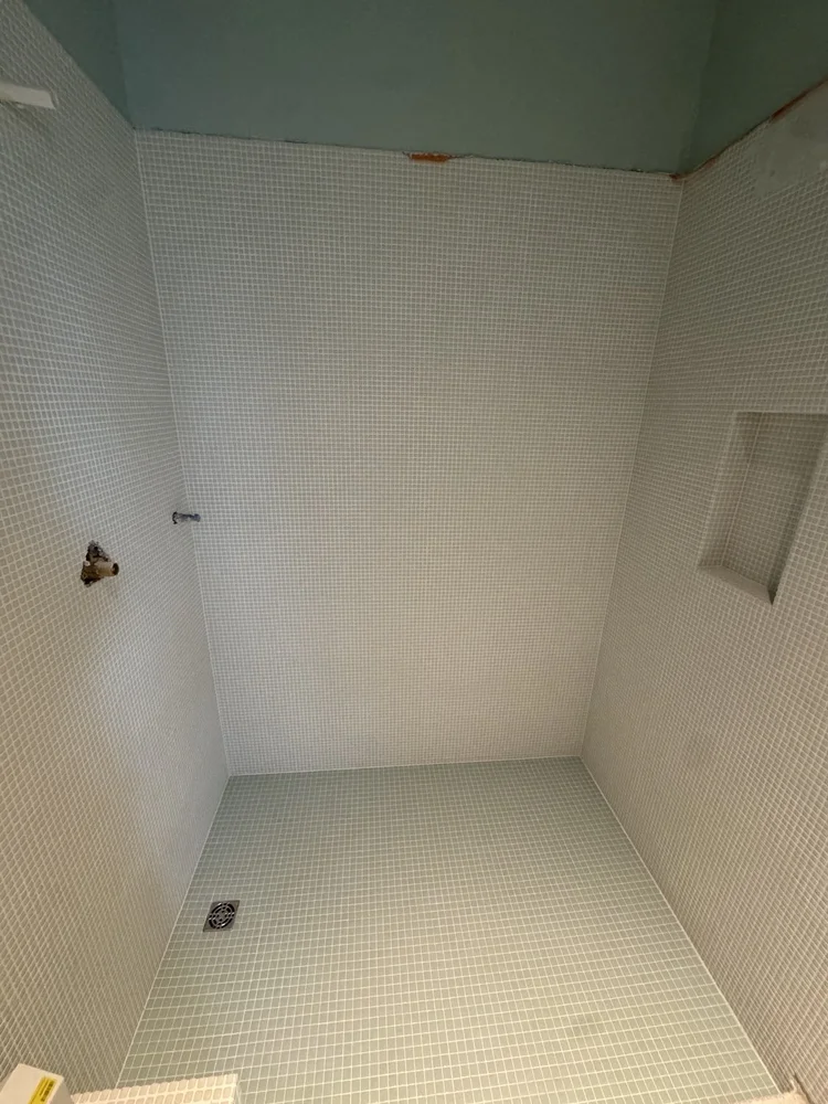 Green and white mosaic installation — project view.