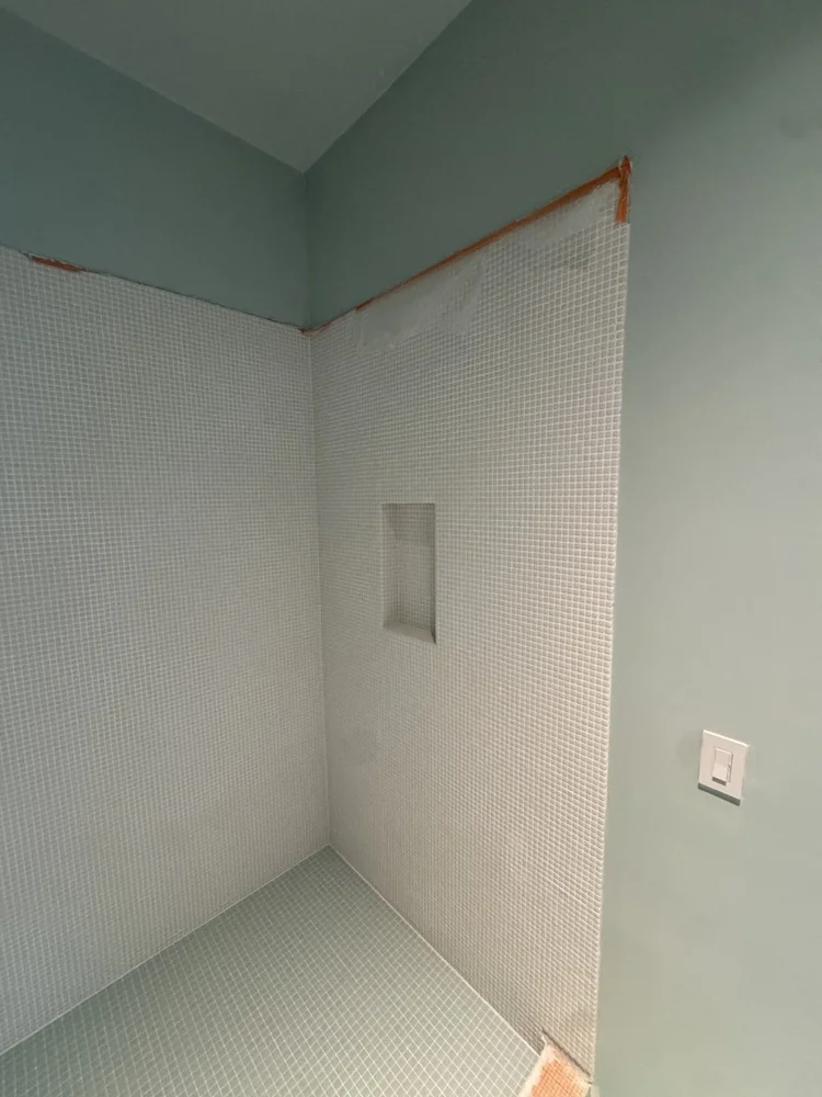 Green and white mosaic installation — project view.