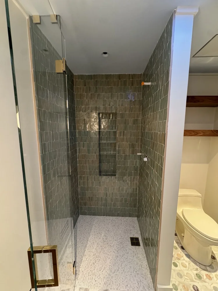 Green tile shower installation — project view.