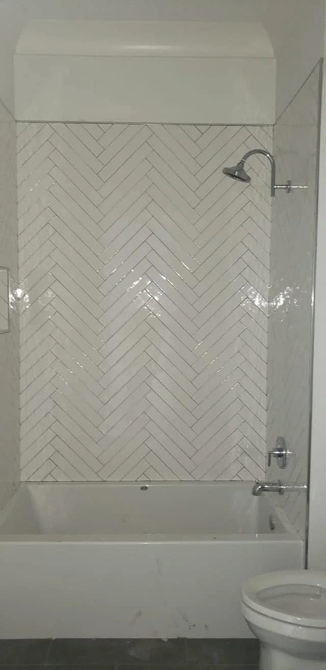 Shower tile and fixture details — EC Construction project photograph.