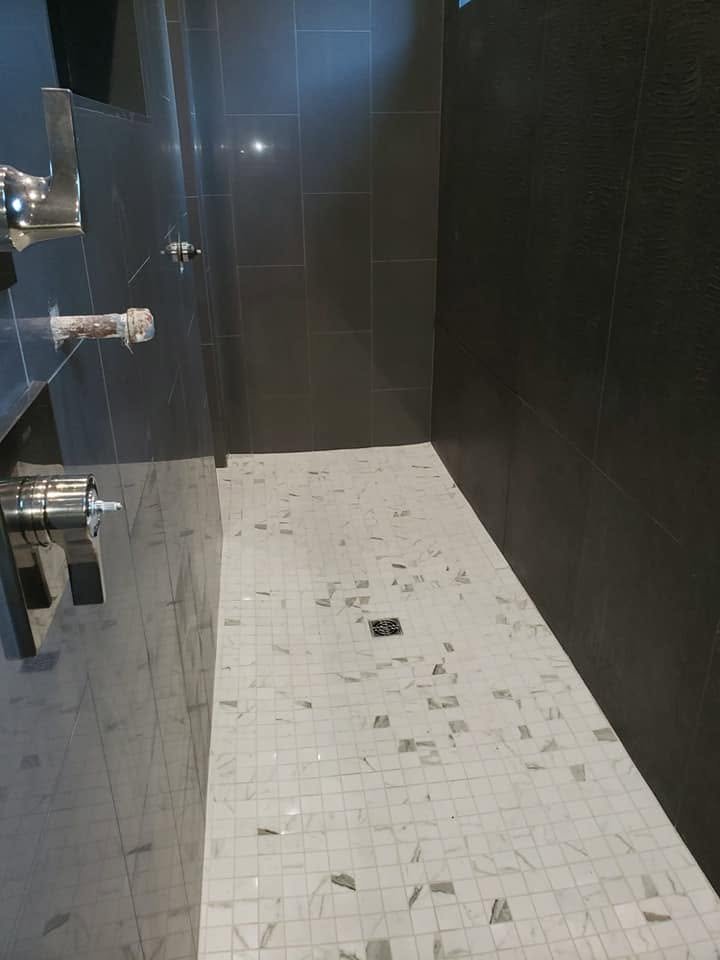 Shower tile and fixture details — EC Construction project photograph.