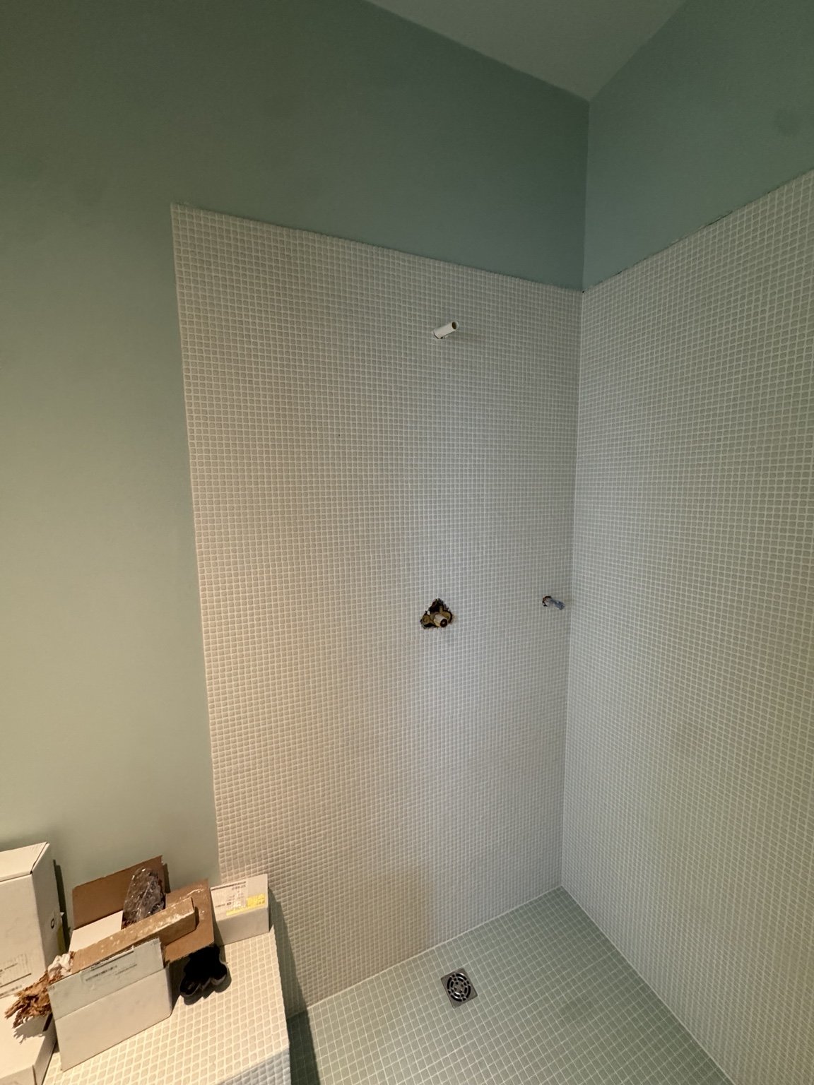 Green and white mosaic installation — project view.