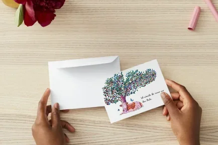 Switzerland Post Card — postcard of a cow resting under an apple tree