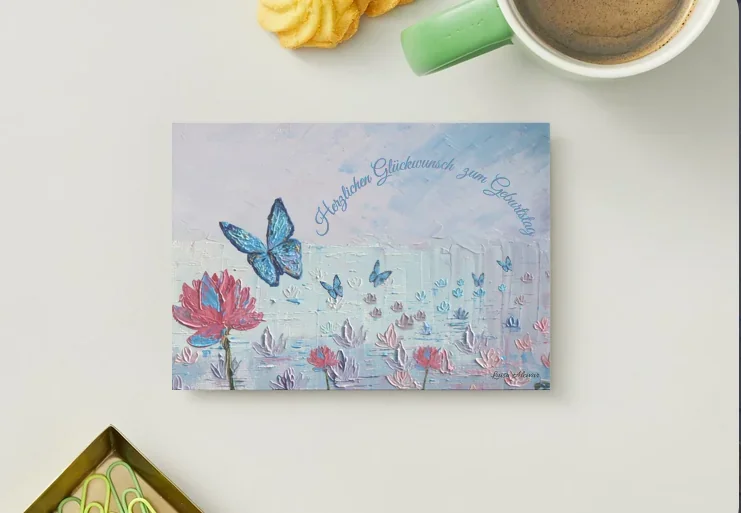Butterfly Coster — birthday card of a blue butterfly over lotus flowers