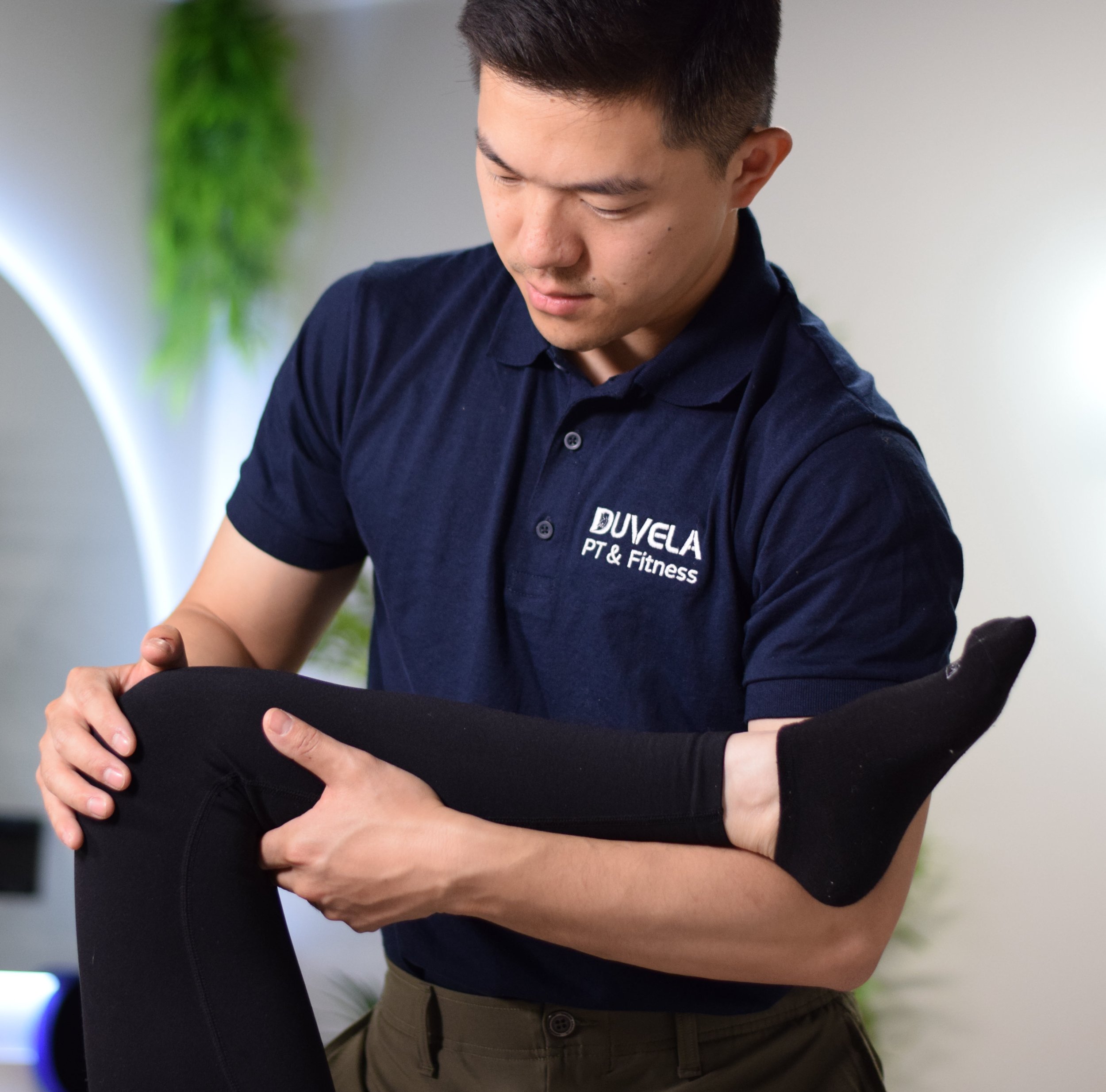 Dr. Gong assessing a patient's leg movement