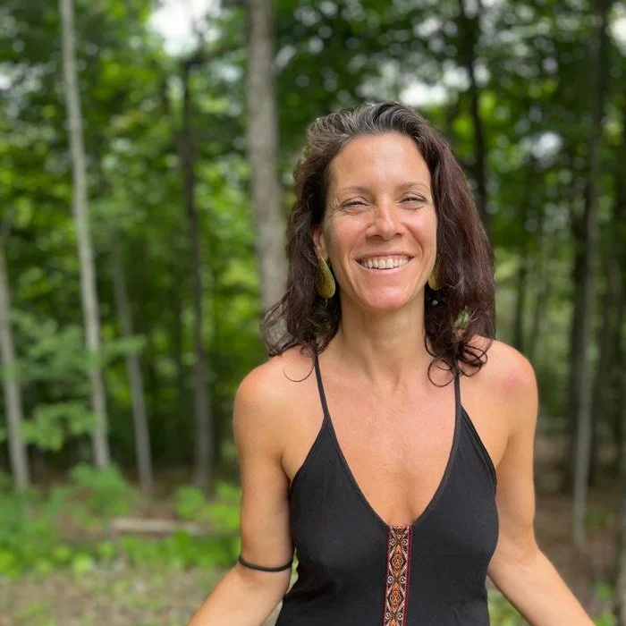 Catherine smiling in nature
