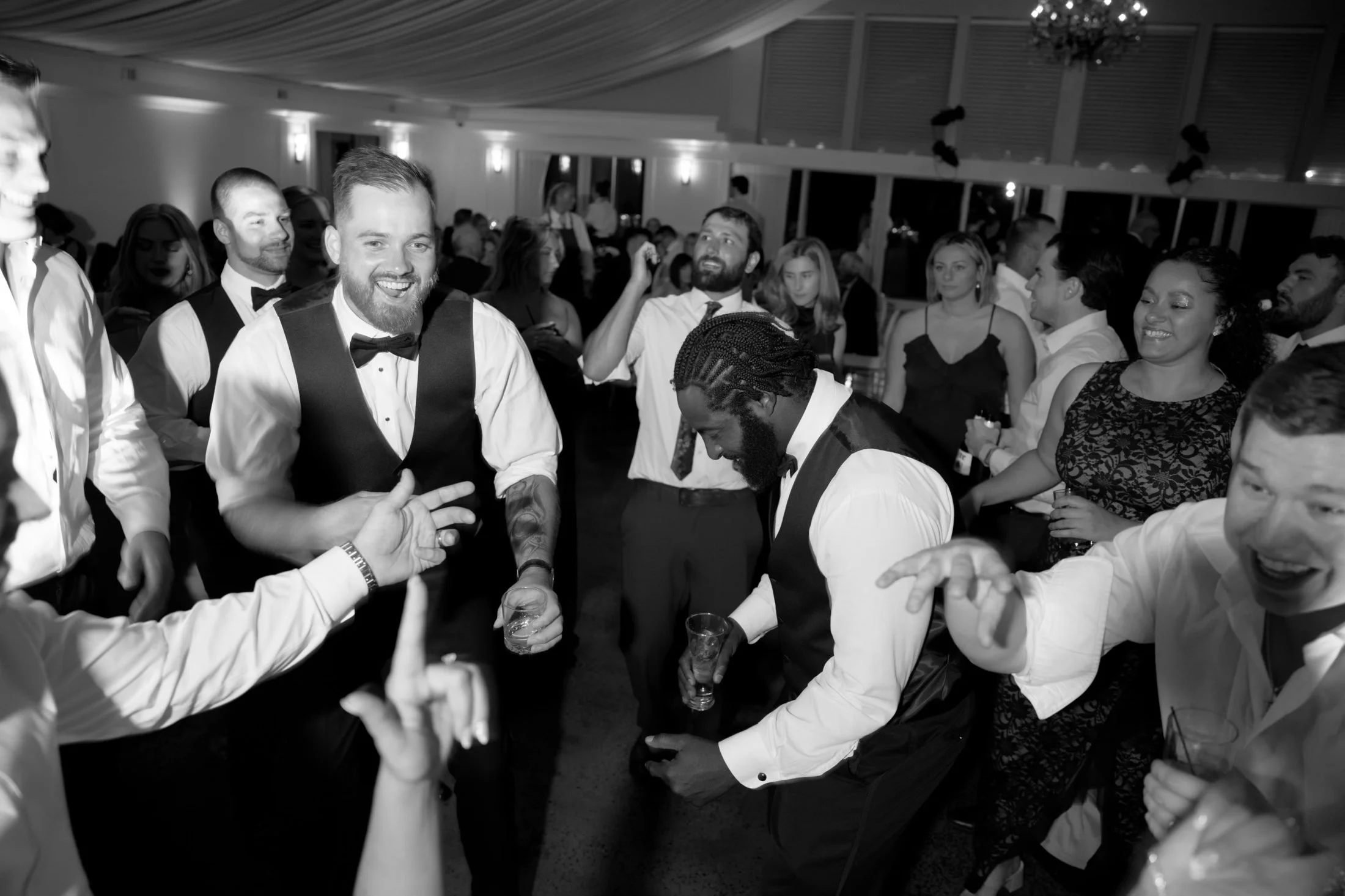 Groom dancing with guests on a packed Evented Sound dance floor