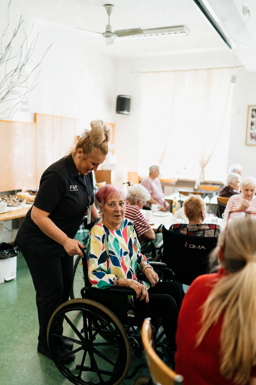 Care professional supporting a resident in a residential care home