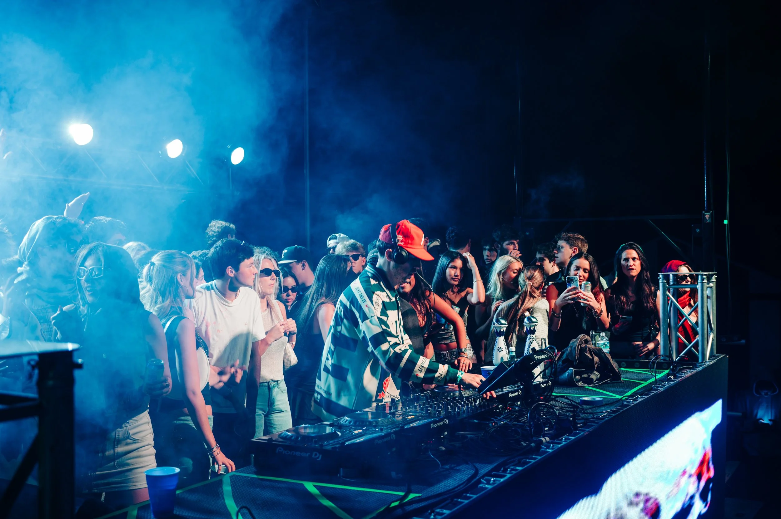 Stage with pink smoke and crowd
