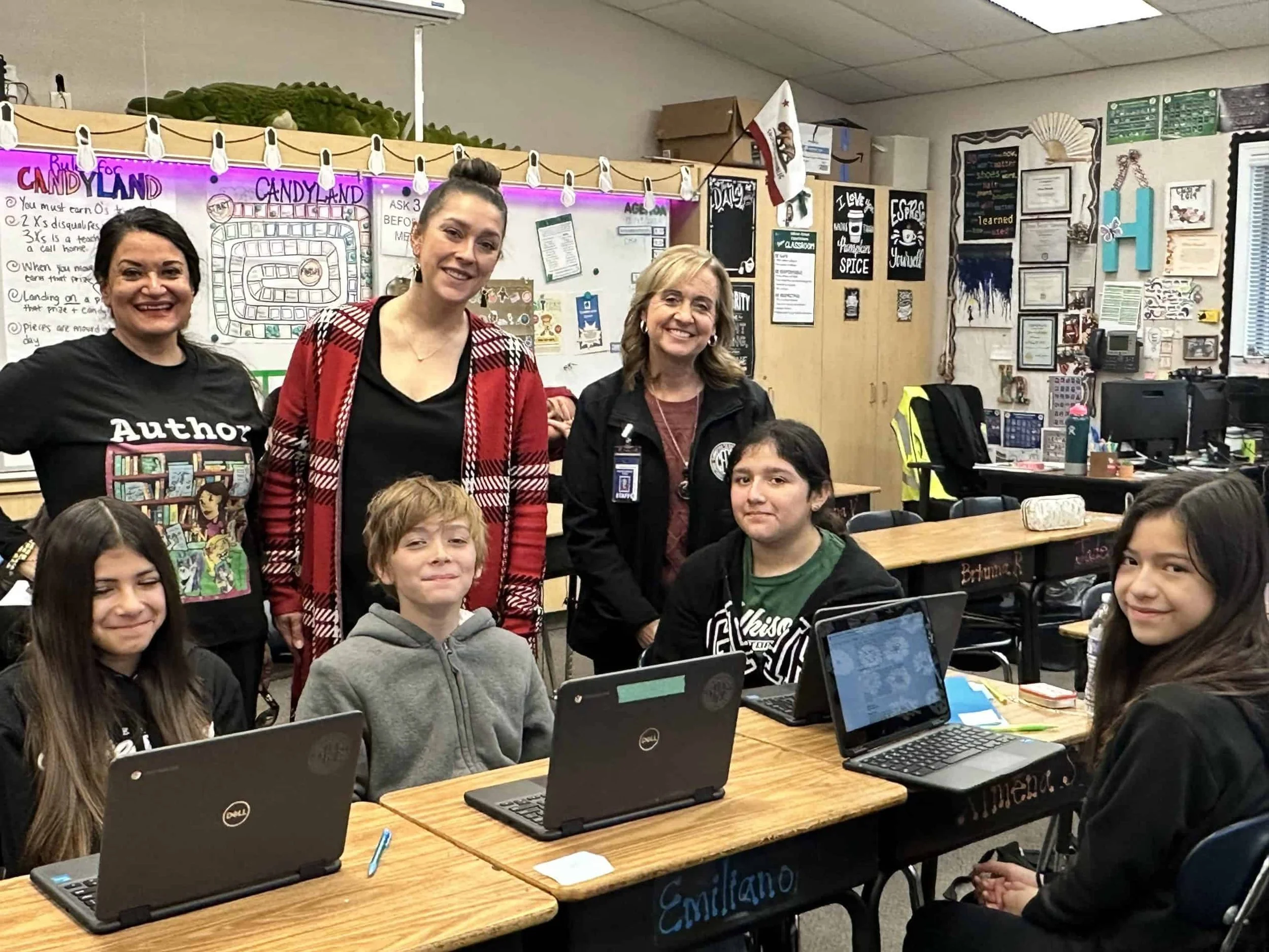 Lisa Caprelli with students and teachers in a classroom