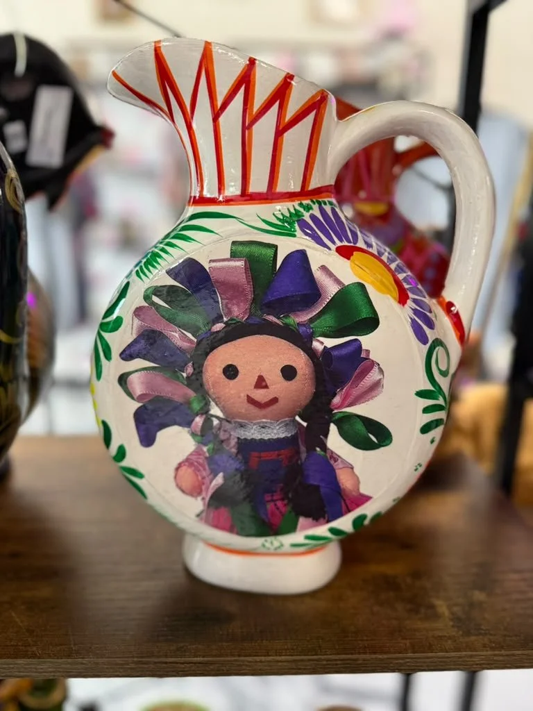 Handmade goods and gifts arranged on shelving inside the shop