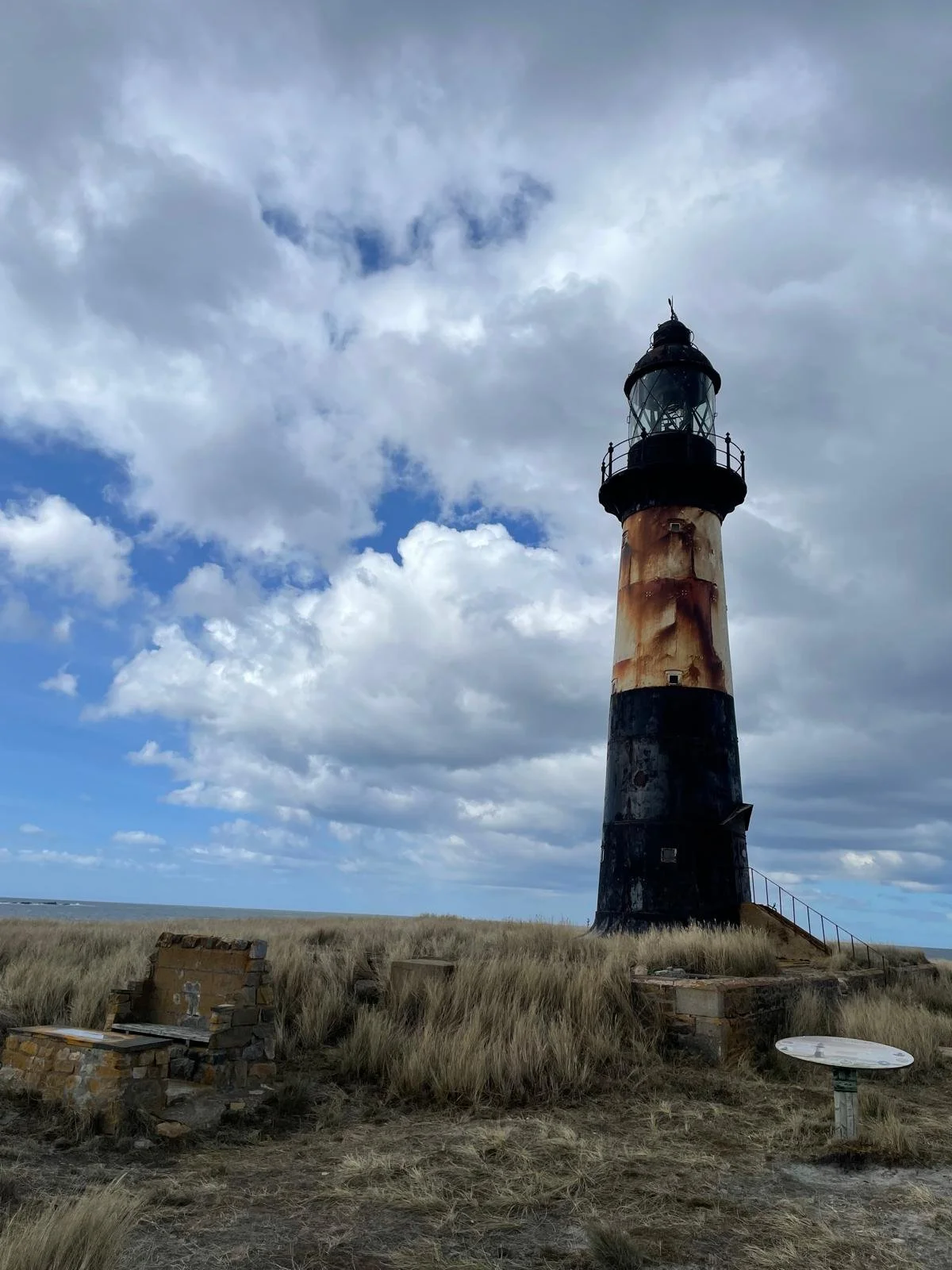 Cape Pembroke lighthouse beneath a dramatic Falkland Islands sky