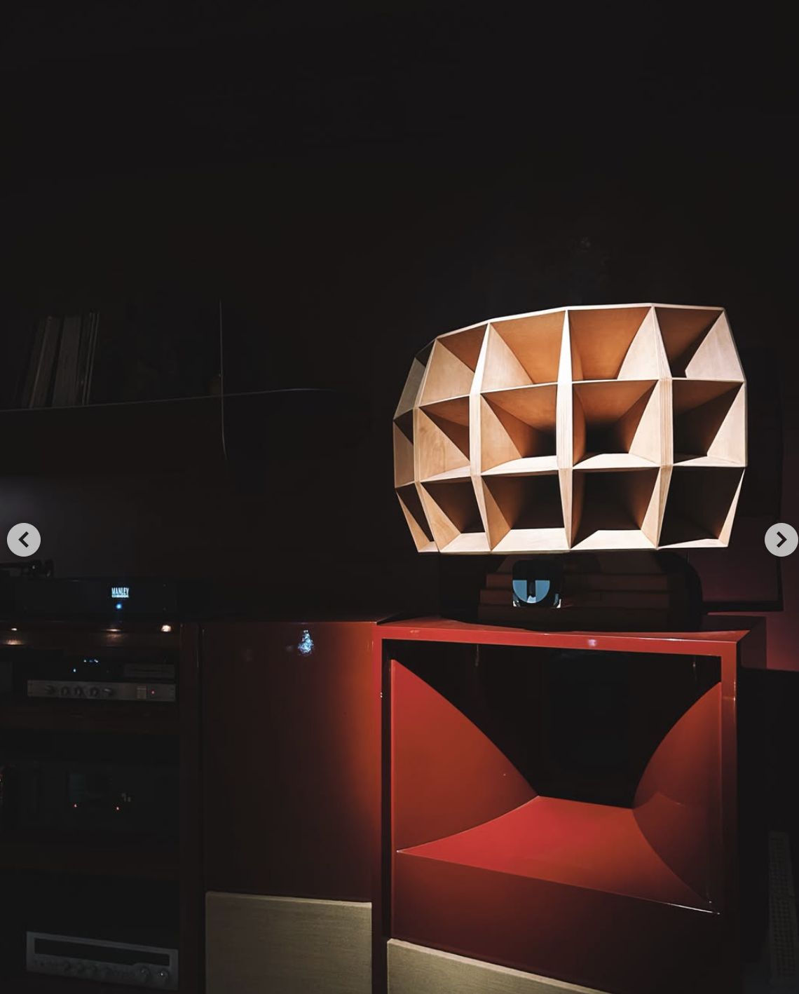 Sculptural sound system in a dark interior