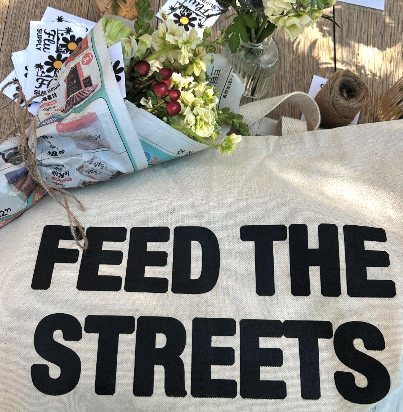 FLWR bouquet and Feed the Streets event tote