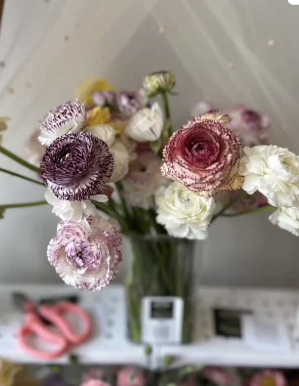 Soft lavender and white floral arrangement in progress
