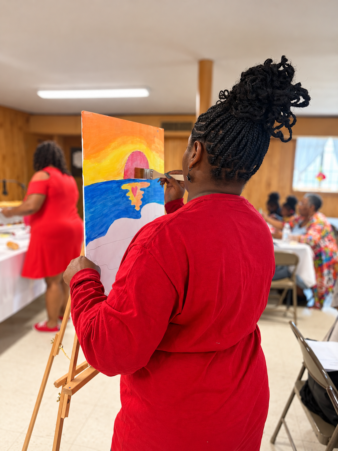 Woman painting during a Women’s Ministry gathering