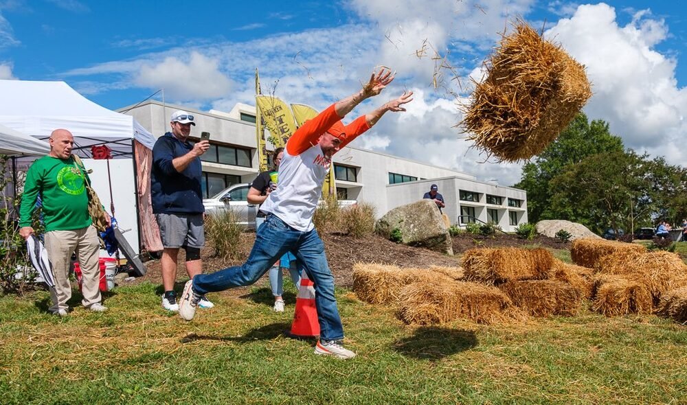 A contestant throwing a hay bale during the Goober Says Hay championship at Mayberry Days