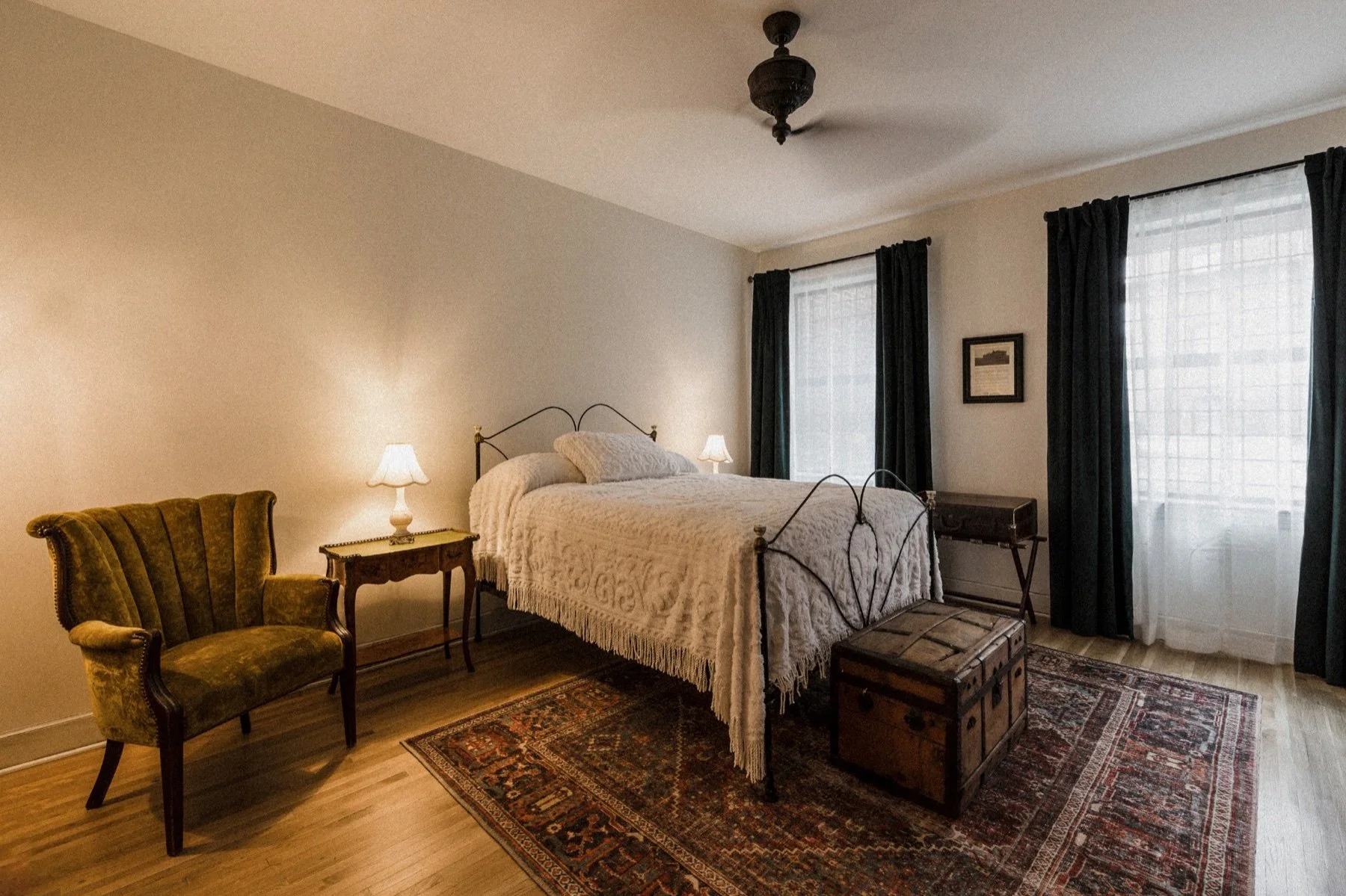 The bedroom in Room 311 at The Read House, with period furnishings and a window behind the bed