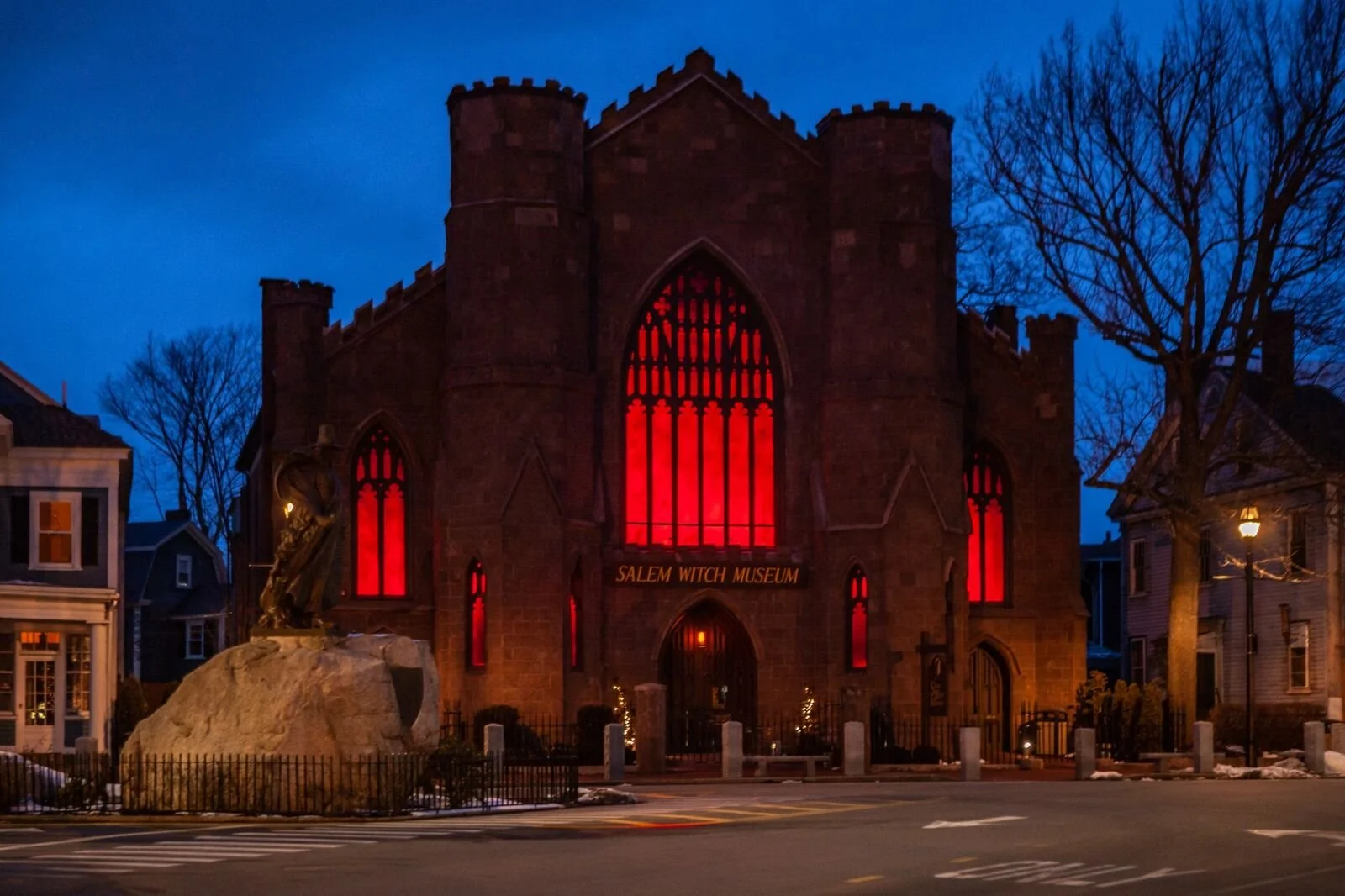 The Salem Witch Museum illuminated red after dark