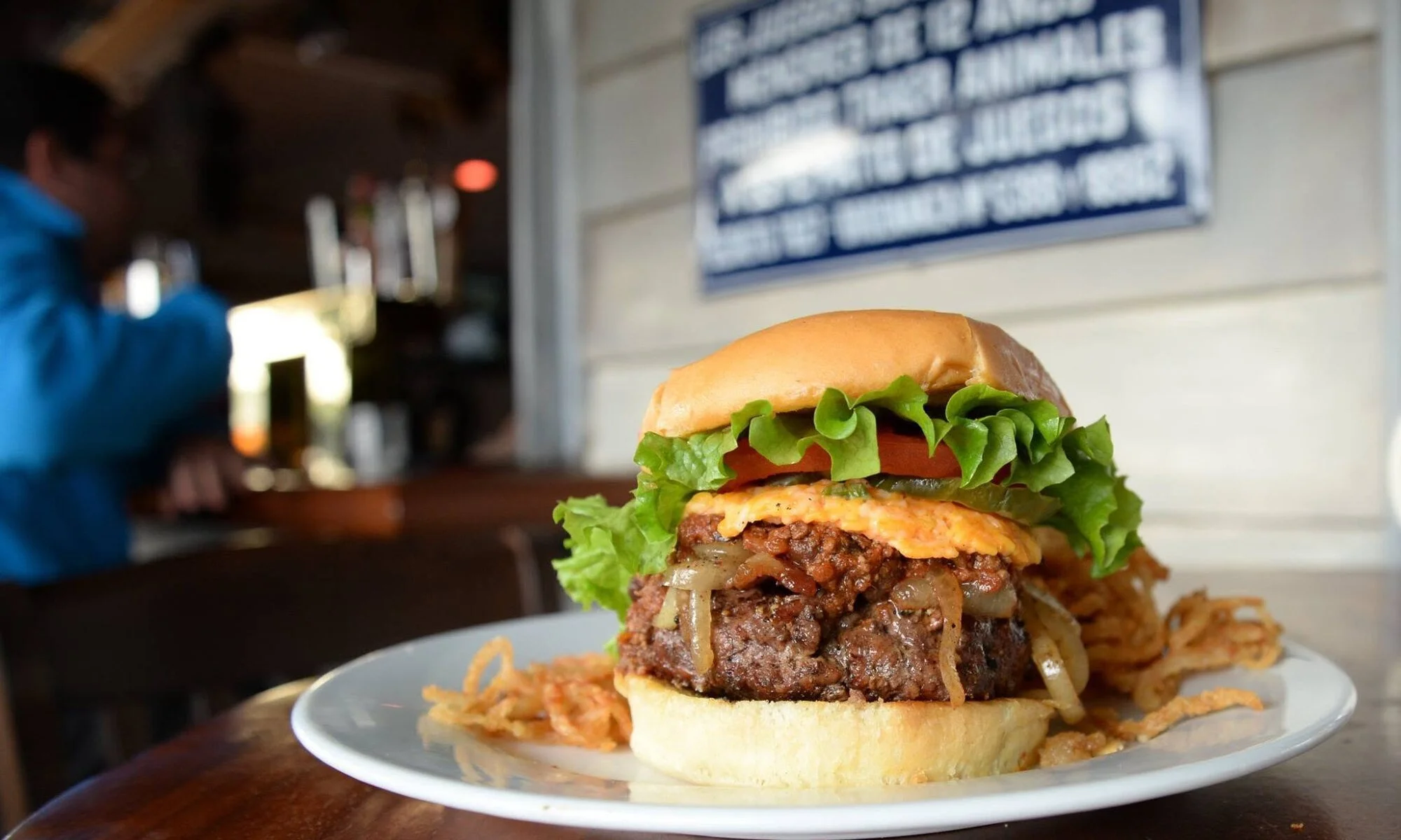 A burger served at Poe’s Tavern