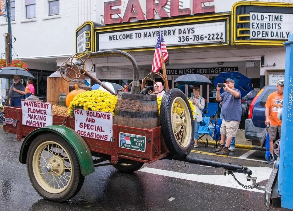 The Mayberry Days Parade passing the Historic Earle Theatre in downtown Mount Airy