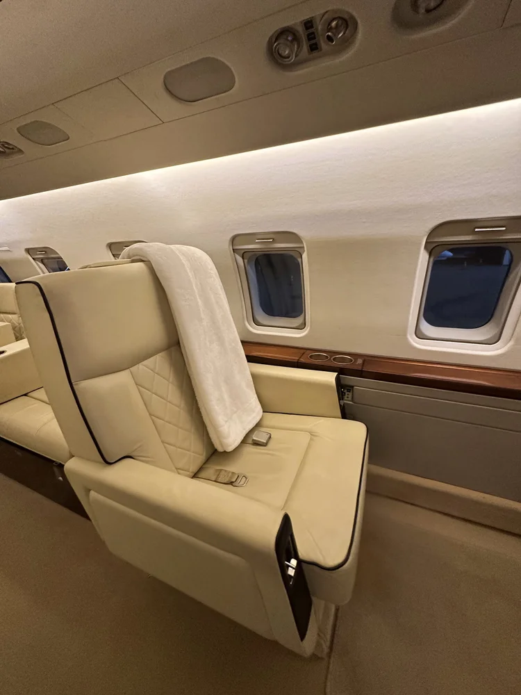 Cream leather jet seat and cabin sidewall after interior detailing