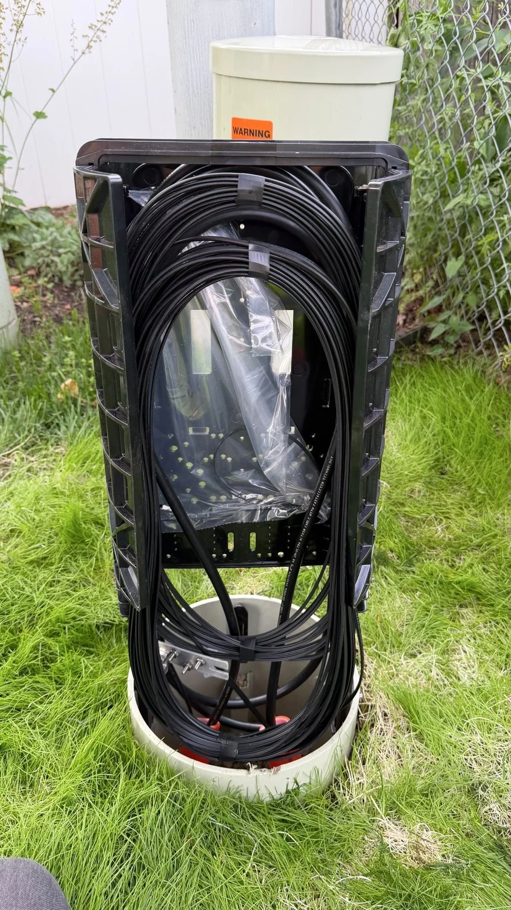 Fiber pedestal in grass.
