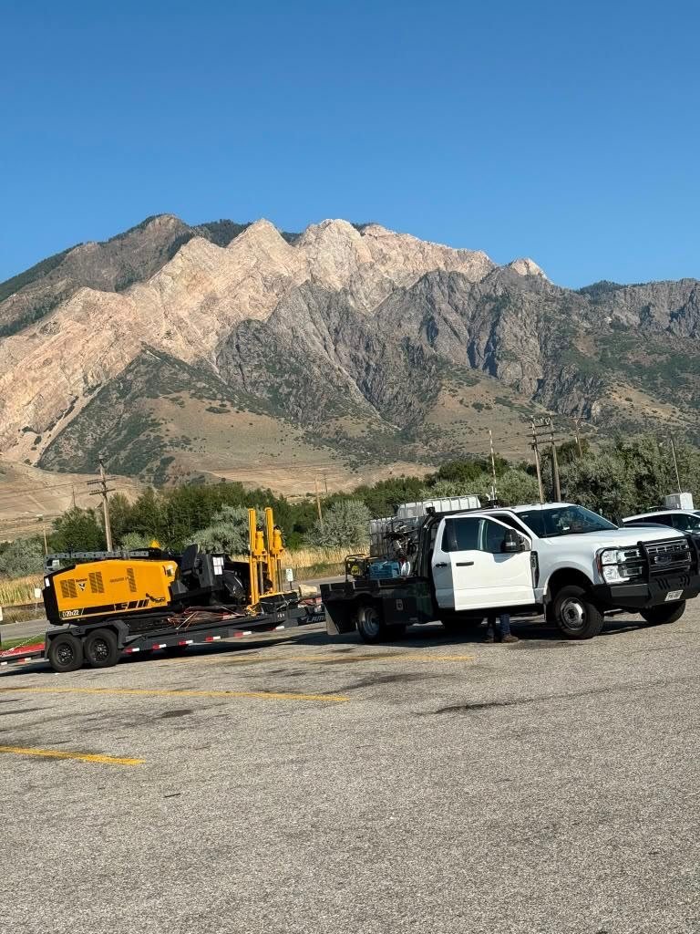 Directional drill rig chained down for transport.