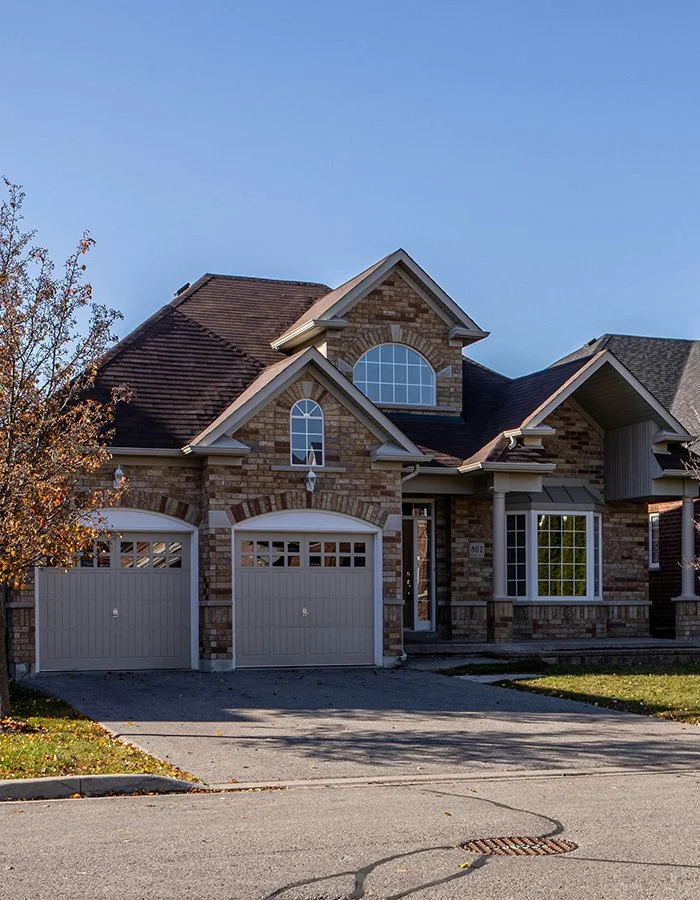 Residential home and driveway for professional house washing and pressure washing services