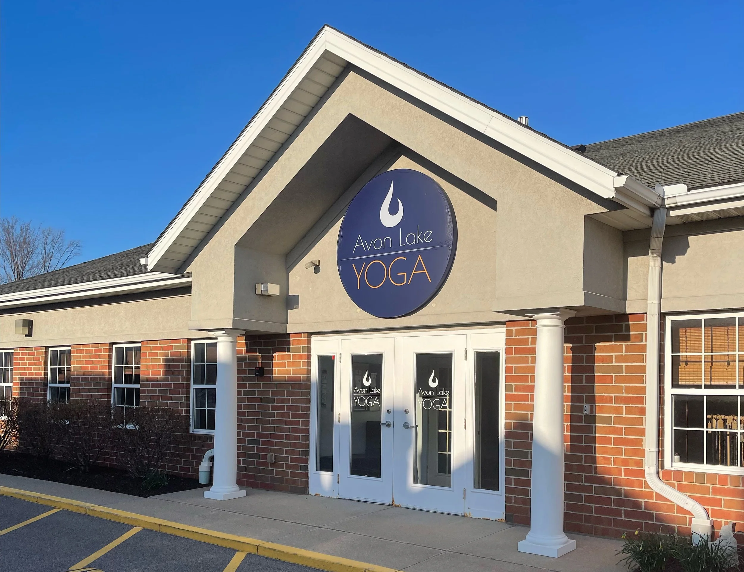 The Avon Lake Yoga entrance in the parking lot behind Taki's Greek Kitchen