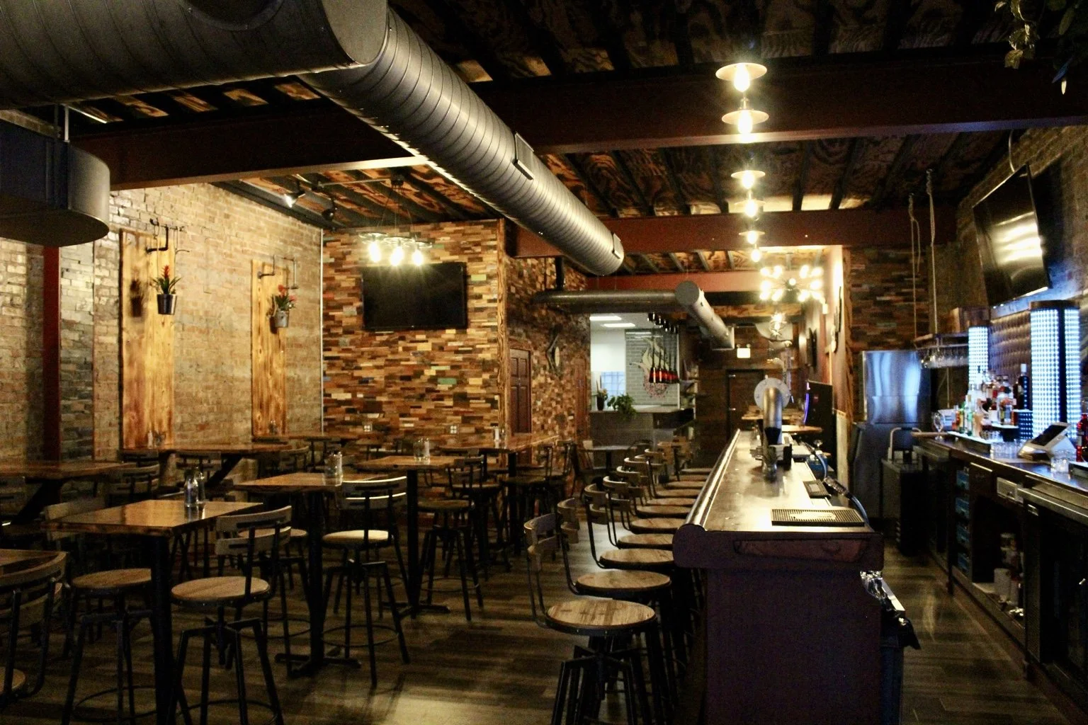 Inside ASH Gastropub, showing the bar and dining room