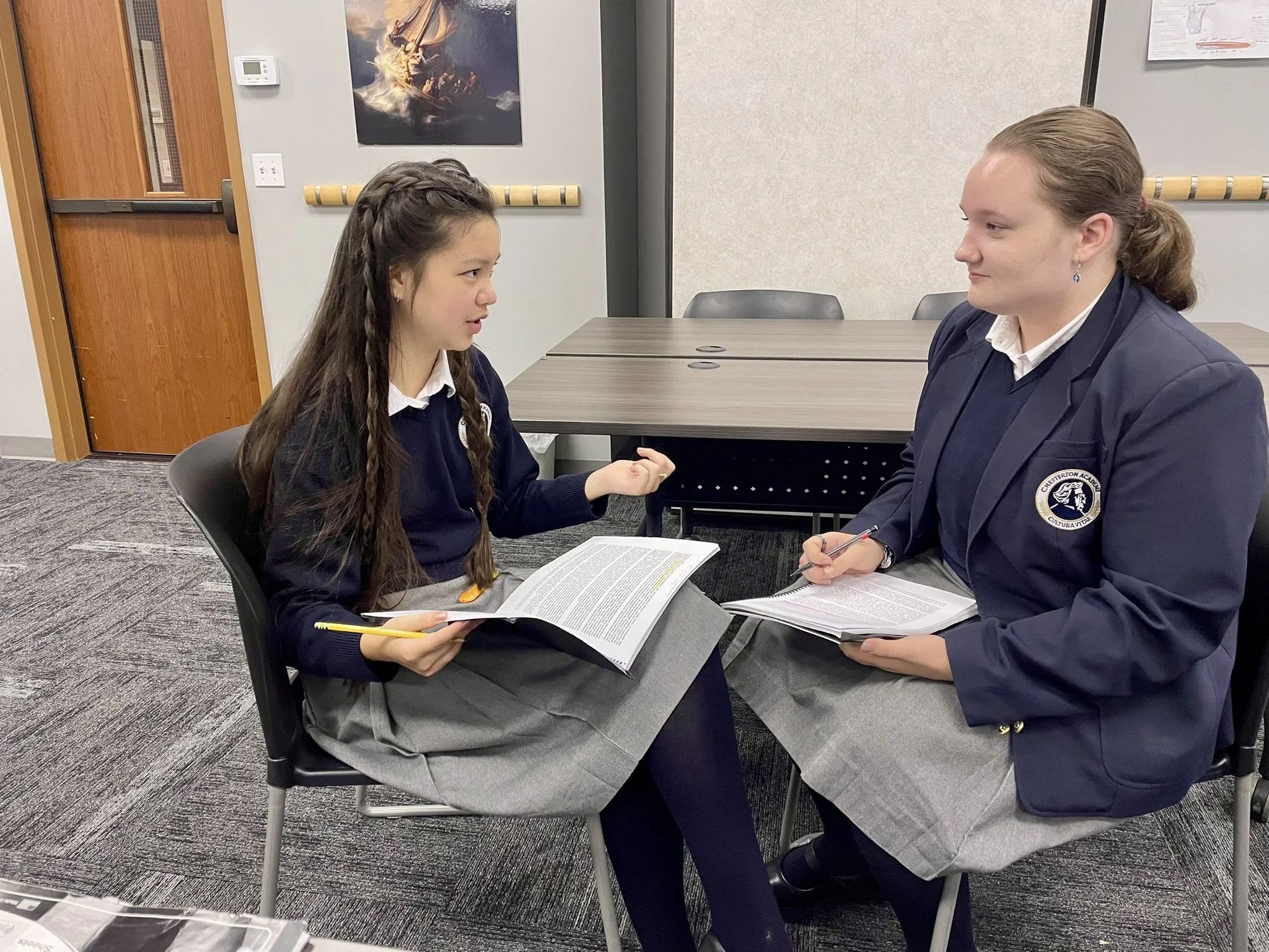 Two students discussing school work