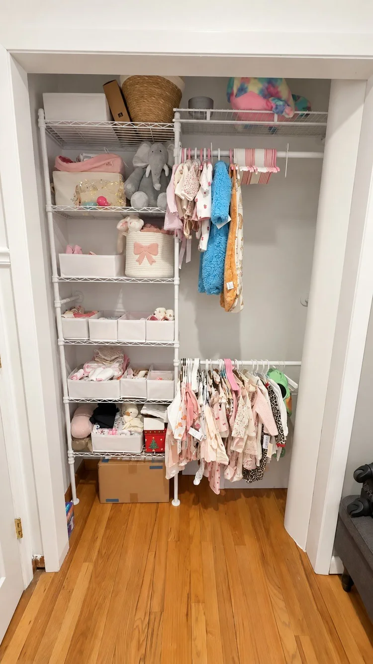Custom white duct cover blending with the closet wall and trim, with the closet in use.
