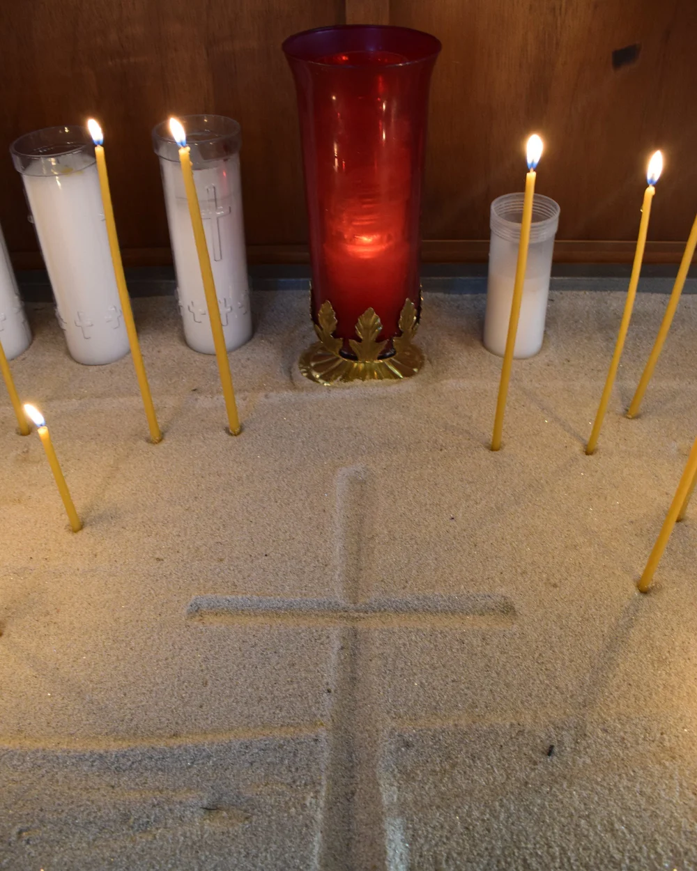 Candles burning at the candle stand in our church