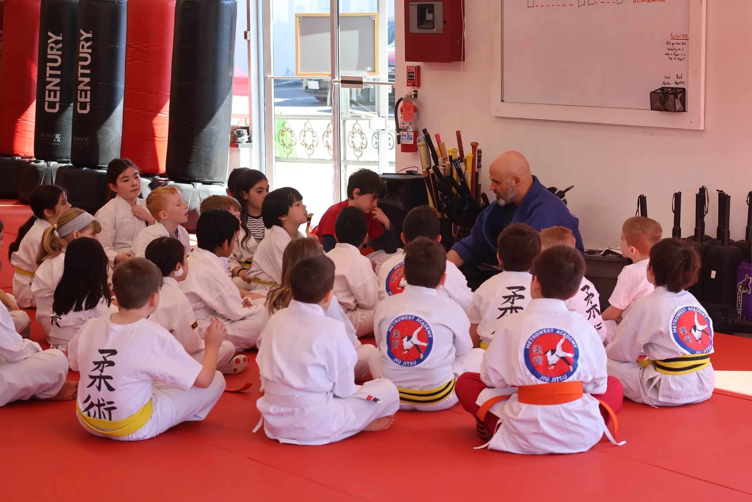 An instructor working with students during class at MetroWest Academy