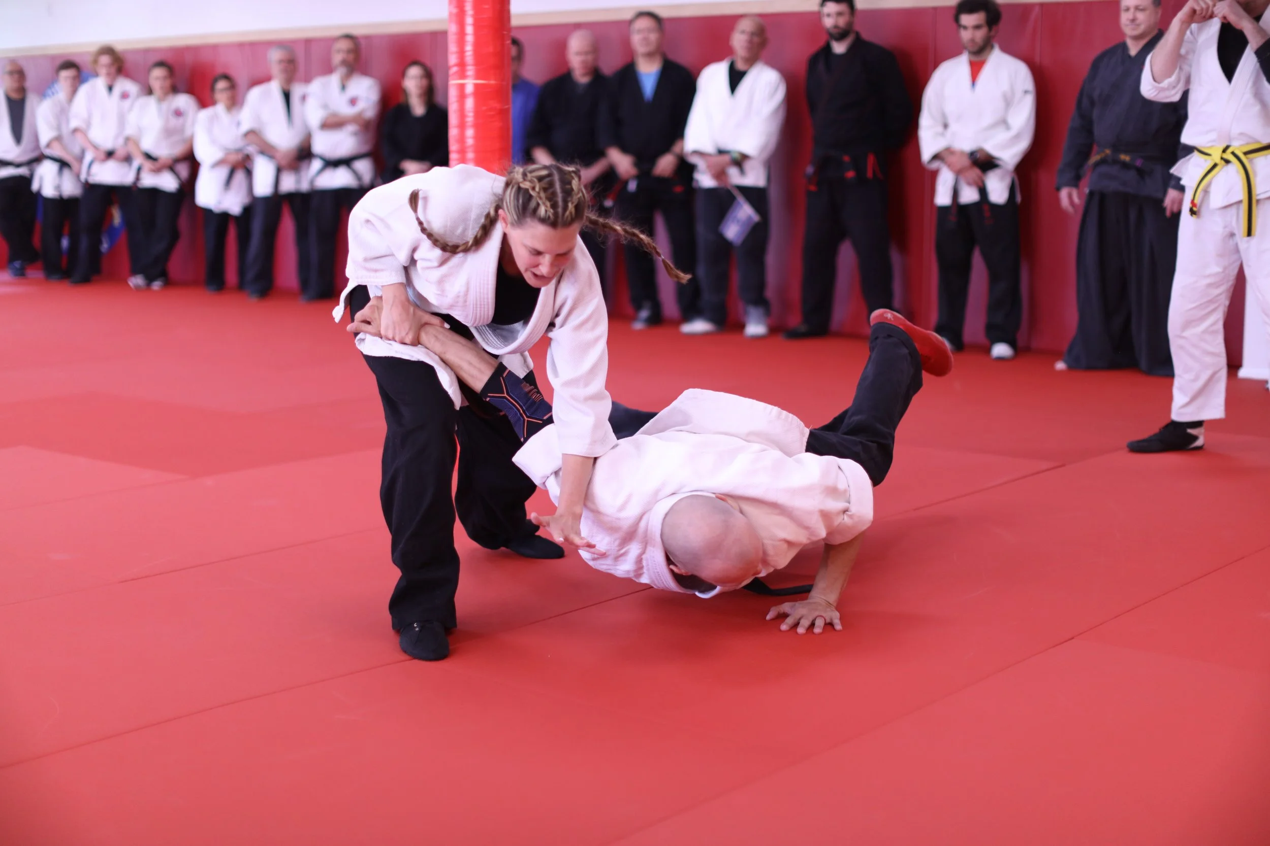 Gi training partners practicing together on the mat