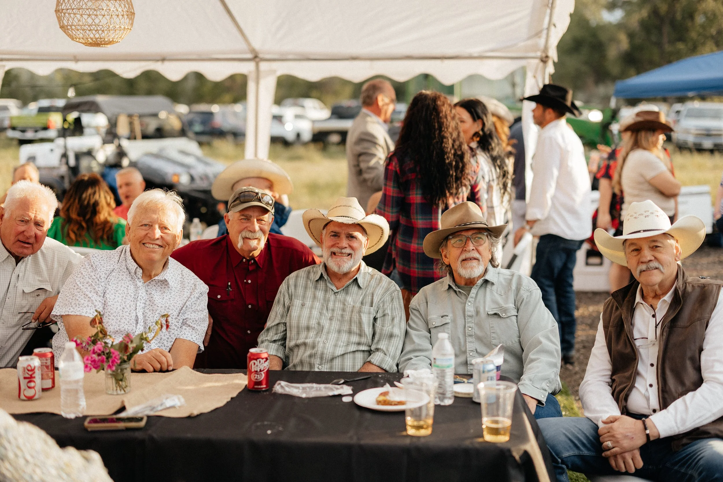 Guests enjoying dinner together at a farm gathering