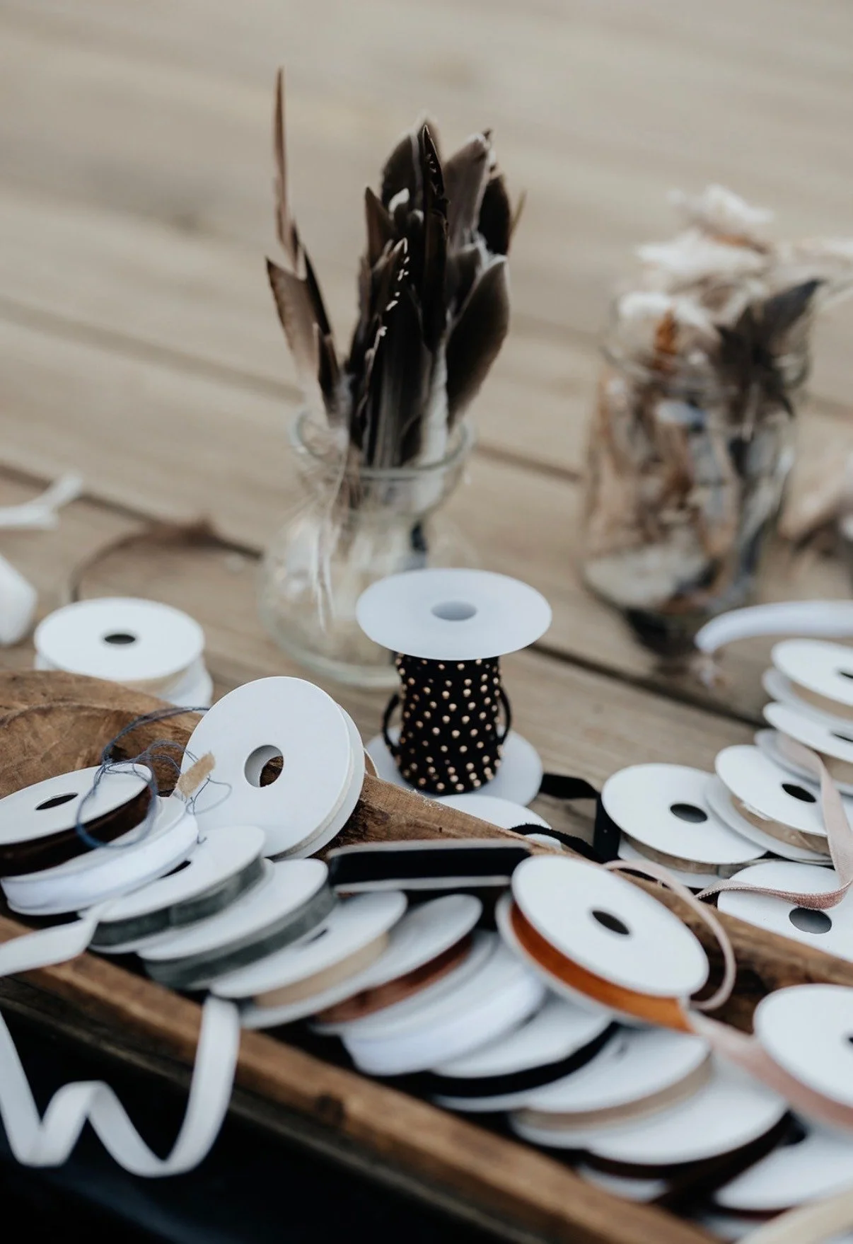 Ribbons and feathers at the hat-decorating station