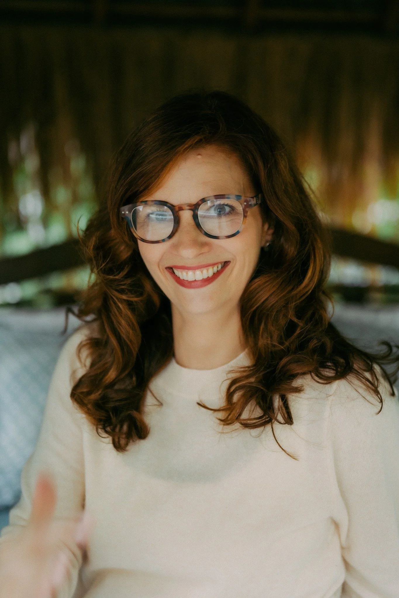 Anna Curran wearing glasses in her Bali studio