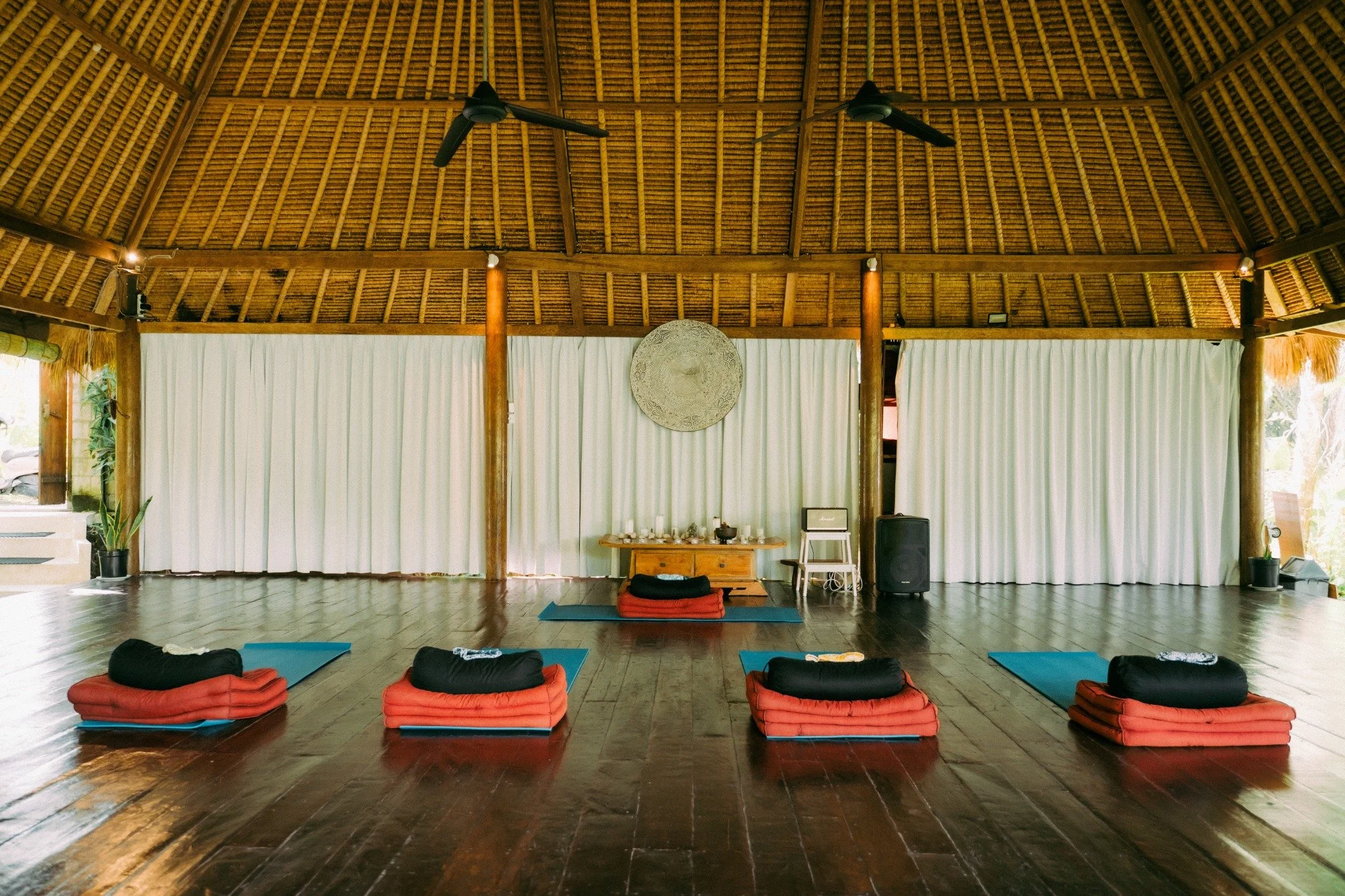 An open-air retreat pavilion prepared for a small-group practice