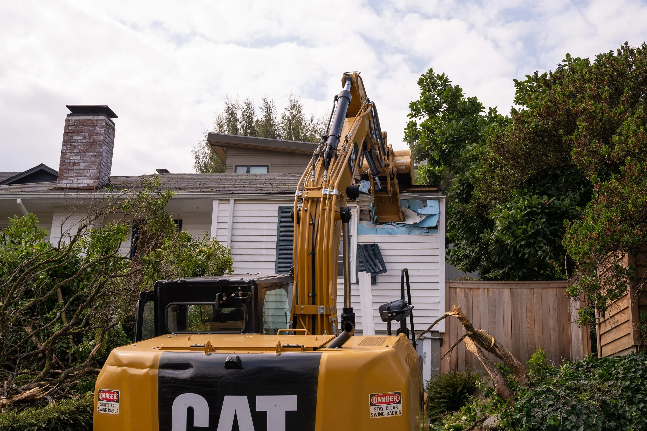 Excavator through the roofline