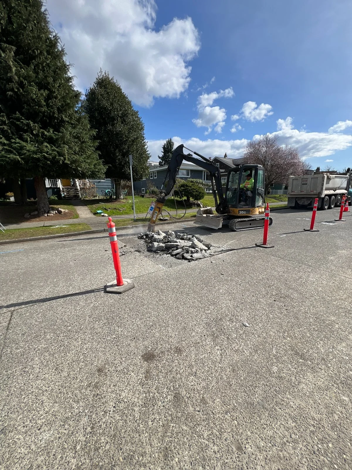 Excavator opening the street connection