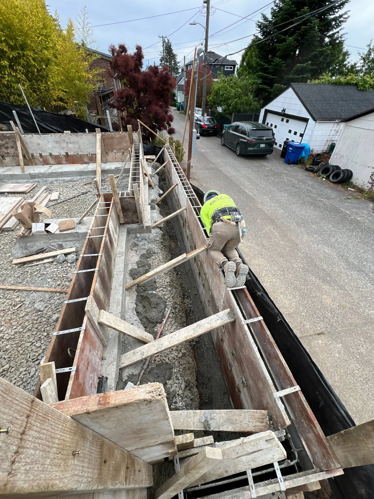 Foundation wall formwork along the alley