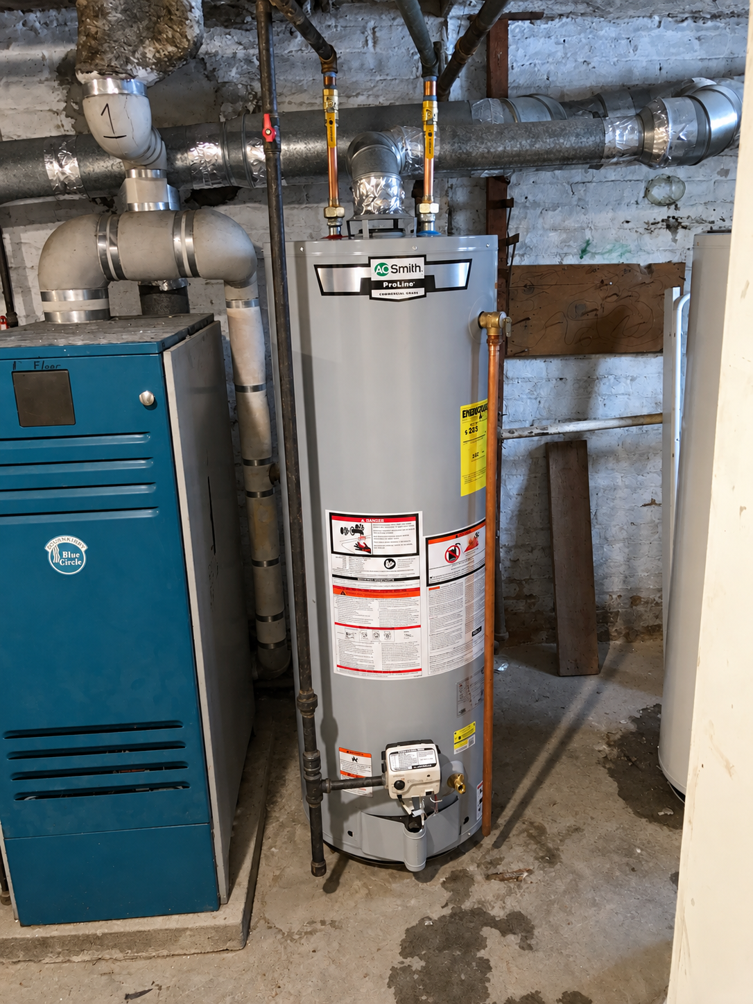 AO Smith water heater installation with copper connections and venting