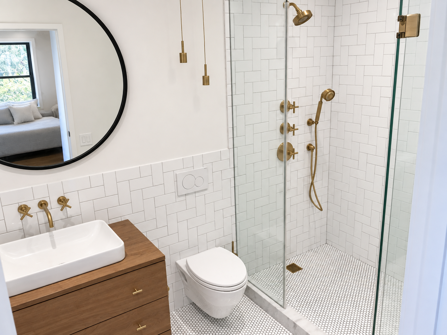 Modern bathroom with a glass shower, gold fixtures, vessel sink, and wall-mounted toilet