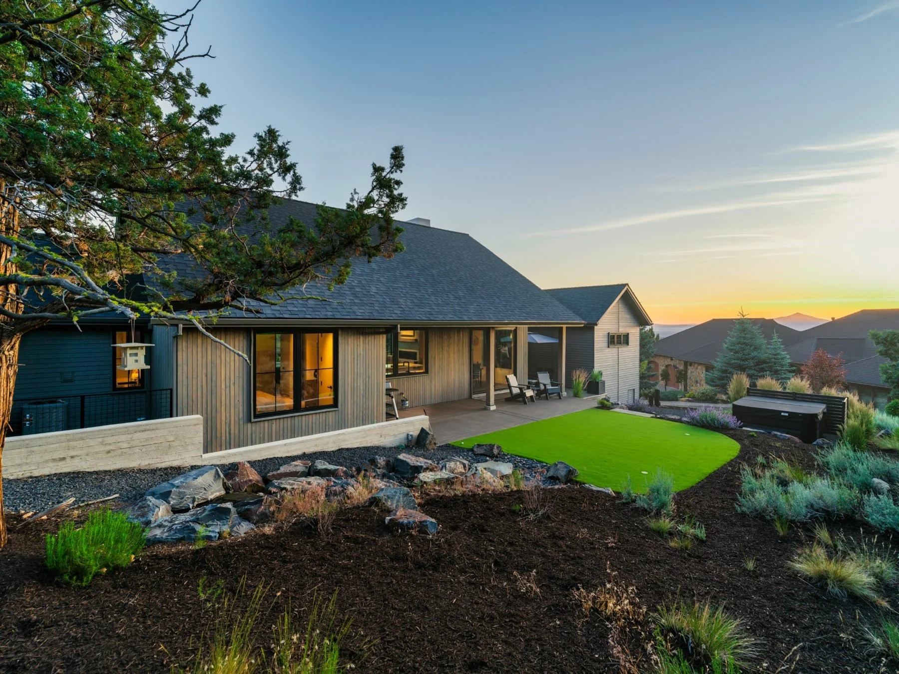 Ironstone in Eagle Crest at sunset, with patio, putting green and Cascade views