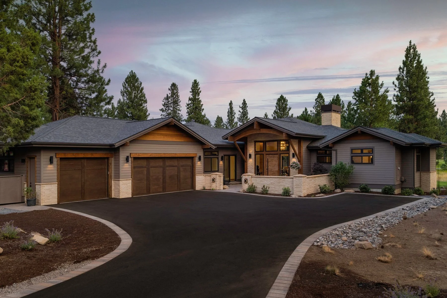 Golden Stone, a custom home in Aspen Lakes, Sisters at dusk