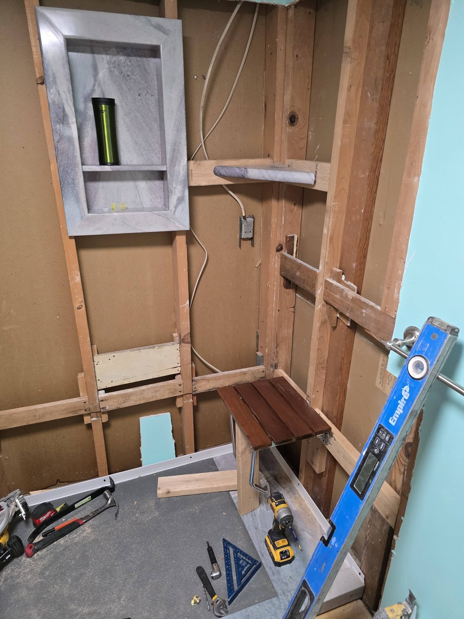 Support framing for the seat, shelves and grab bar