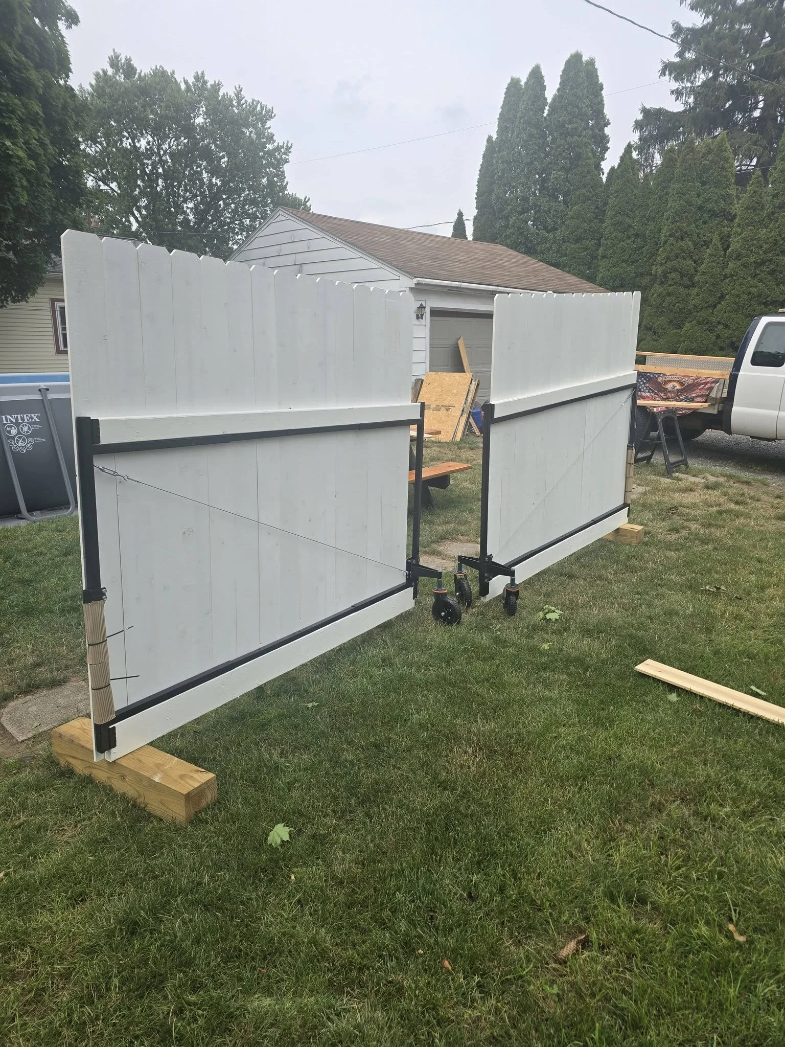 Gate panels resting on wood supports during the build