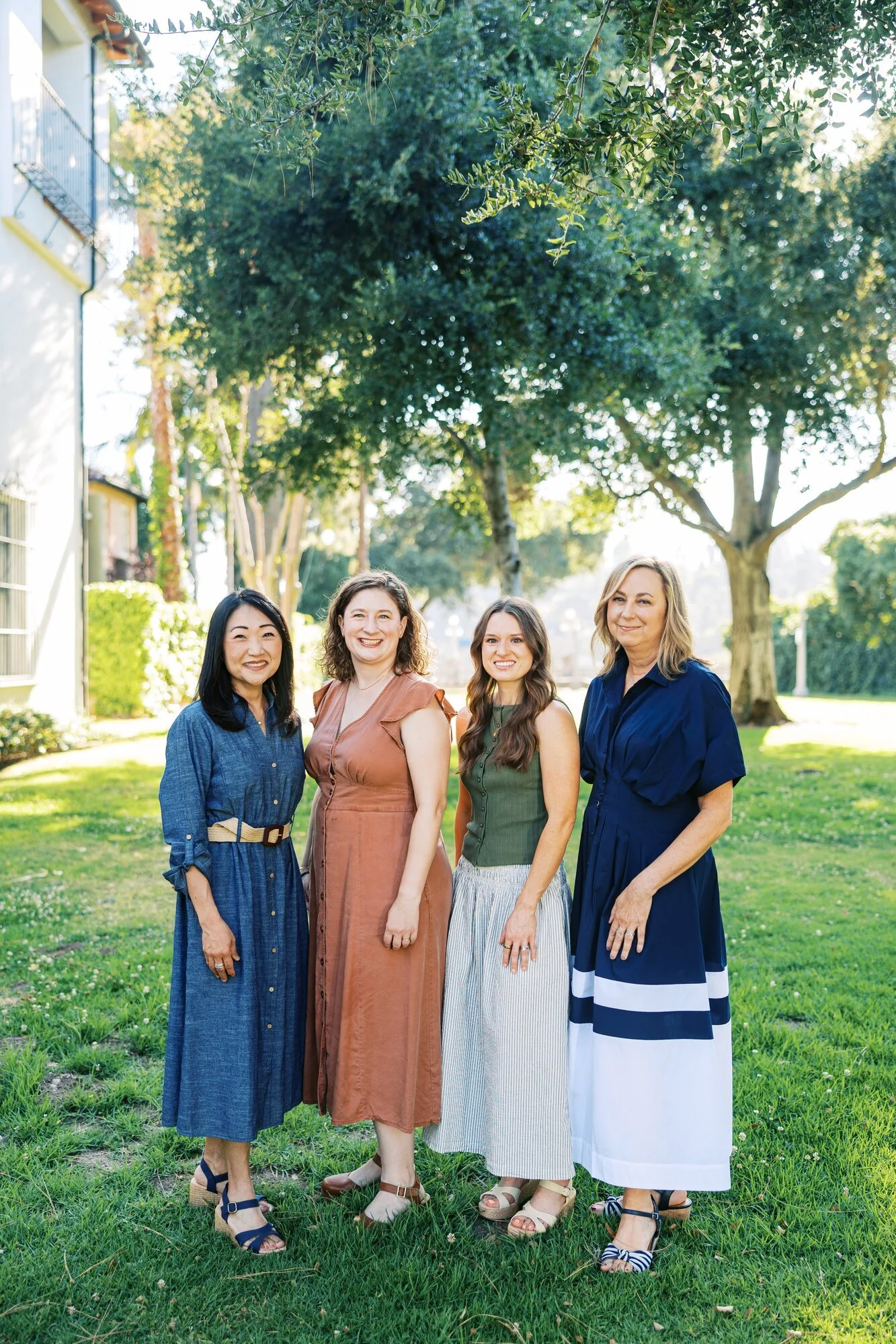 The four Village West providers standing together outdoors.